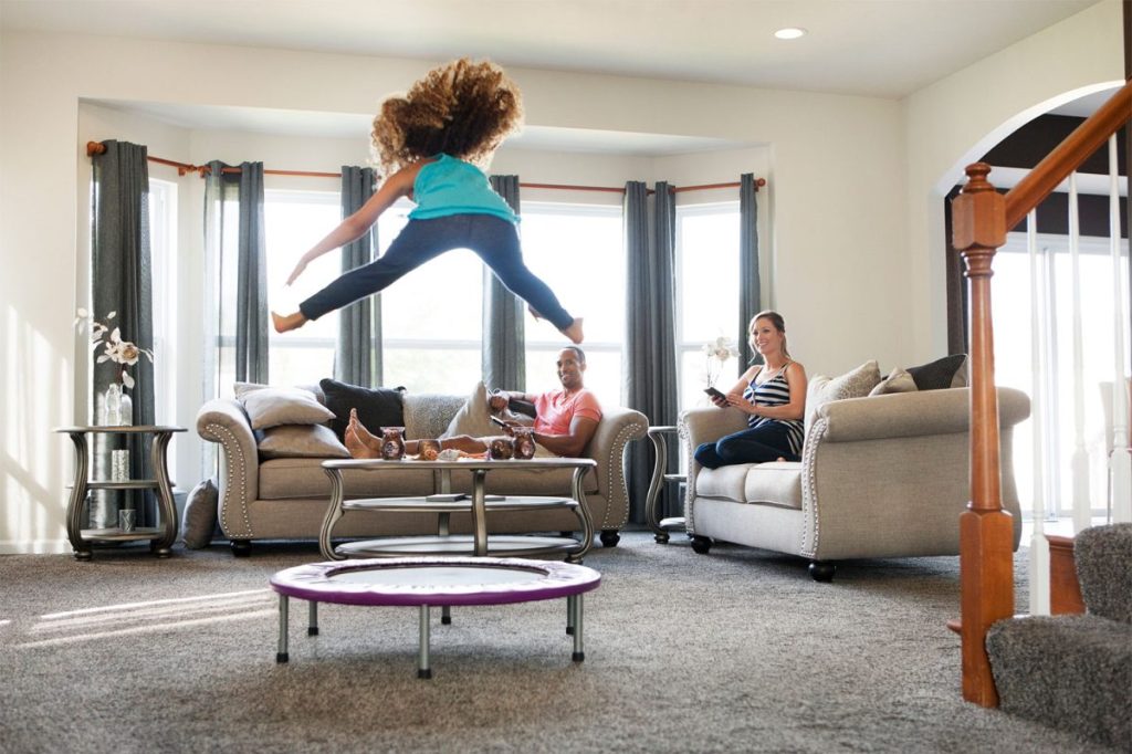 Girl jumping on indoor trampoline