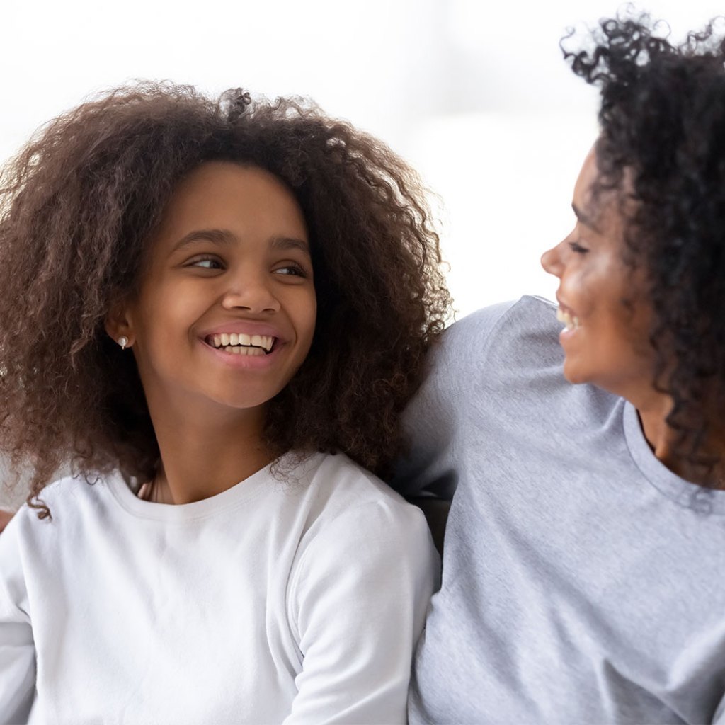 mother and daughter laughing