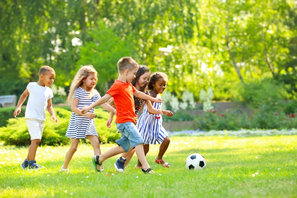 kids playing soccer at a family reunion