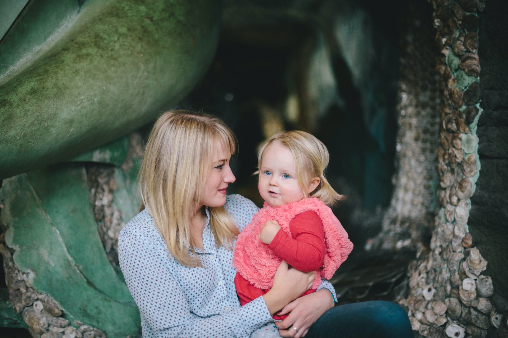Mother holding daughter outdoors