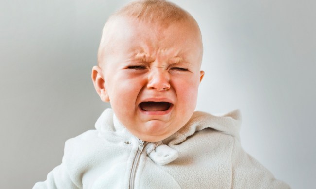 Crying baby sitting up