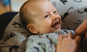 Smiling baby in pajamas