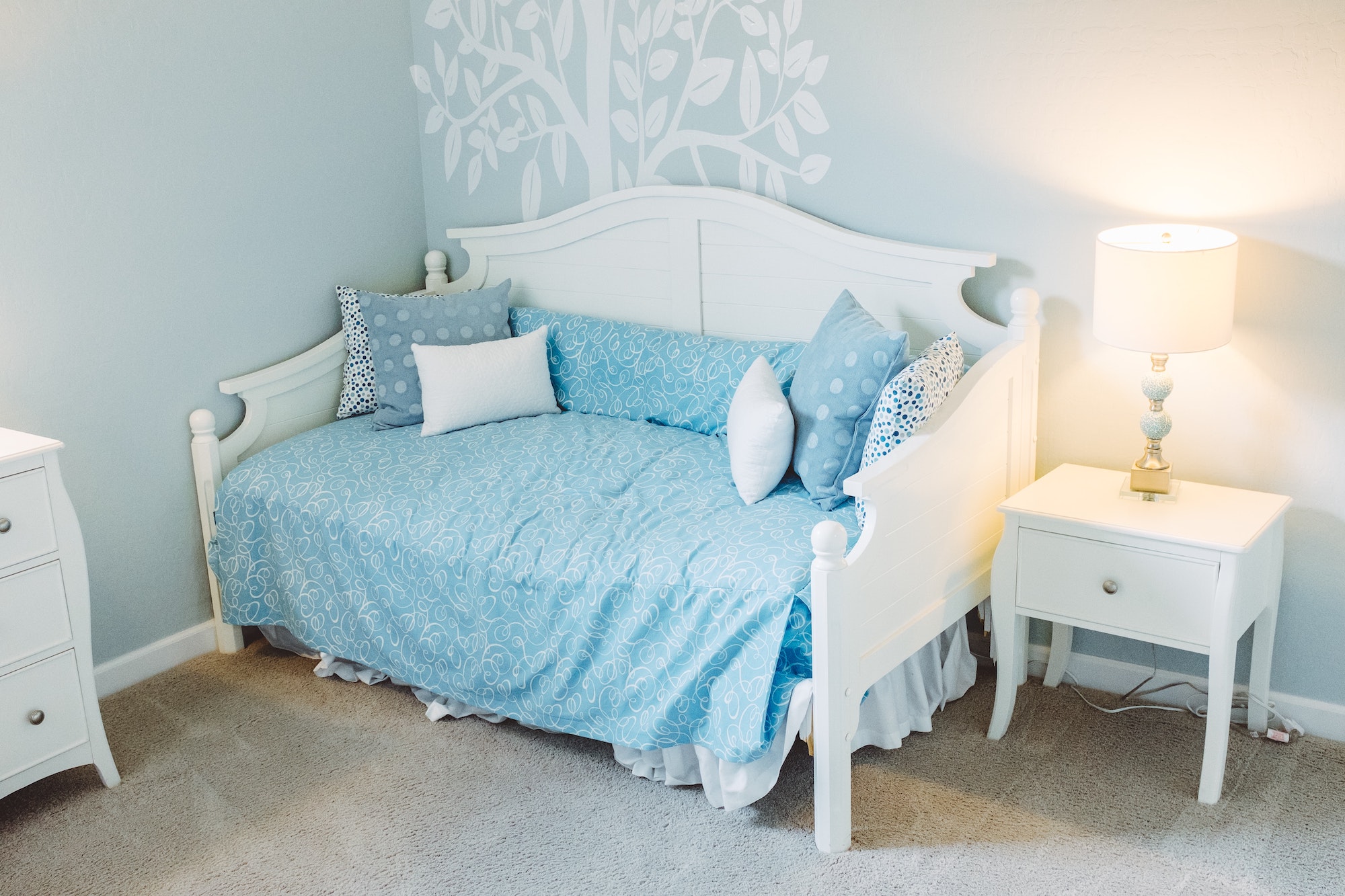 blue and white nursery with bright blue sheets