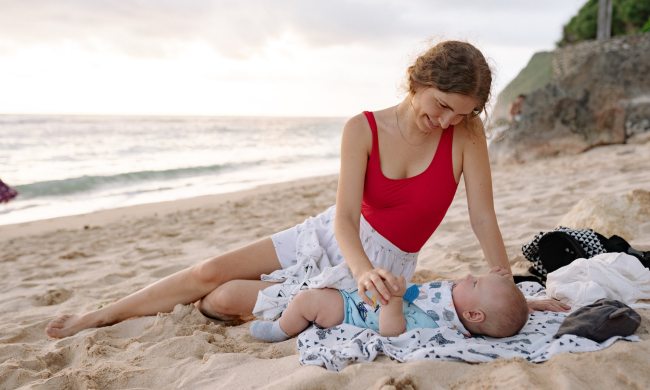 swimwear for newborns woman with baby on beach