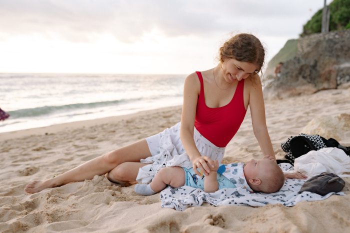 swimwear for newborns woman with baby on beach