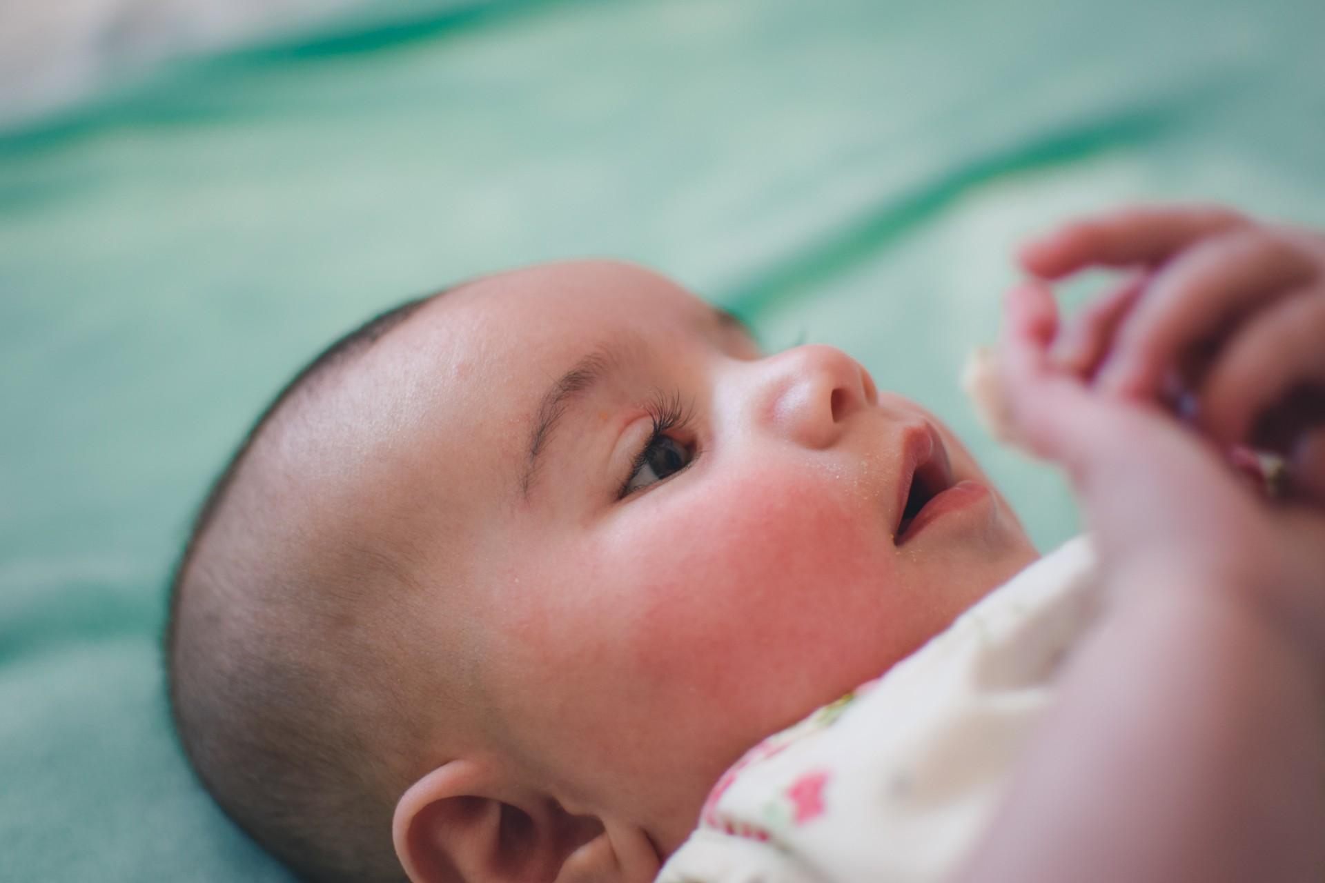 Baby lying in crib