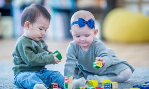 Boy and girl babies at day care