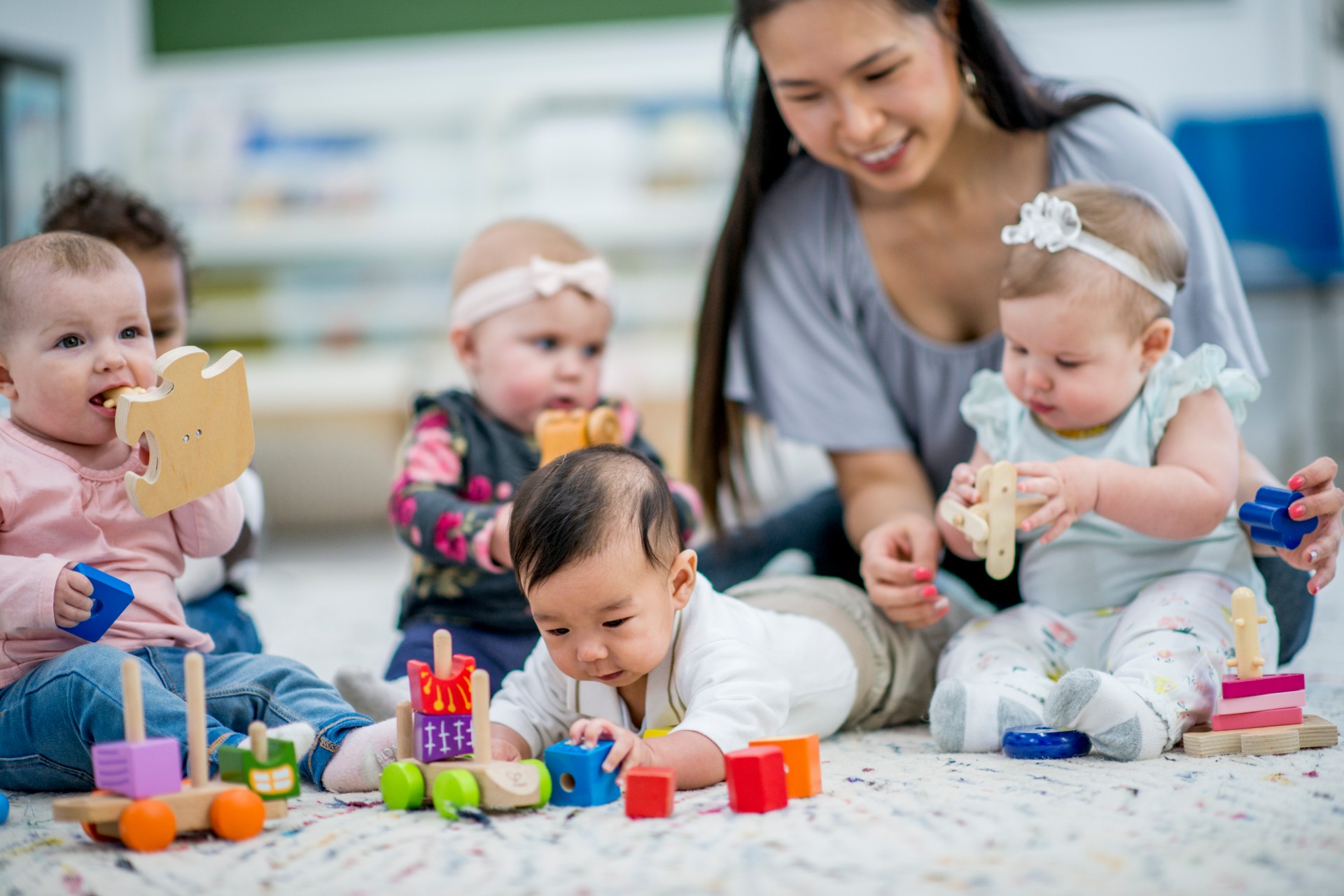 Woman working at day care with children