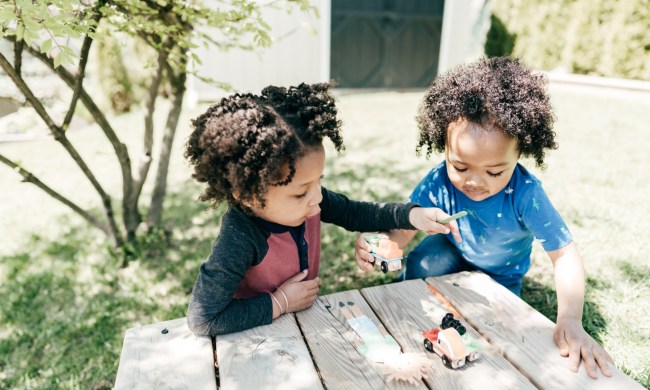 Two toddlers playing outside