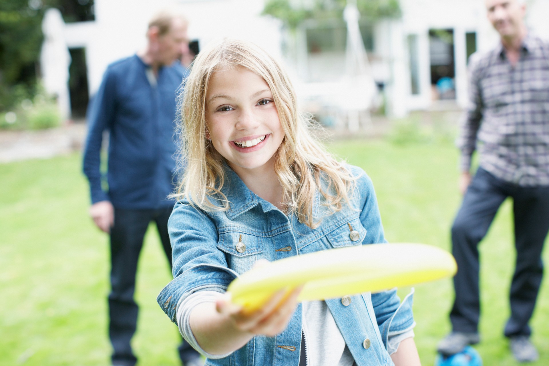 Little girl holding Frisbee