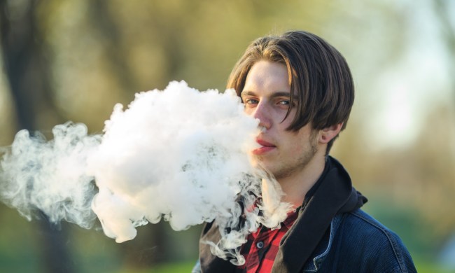 Teen vaping outside