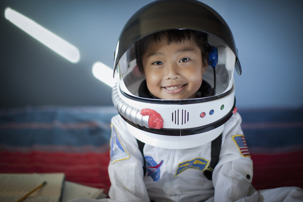 Boy wearing astronaut costume