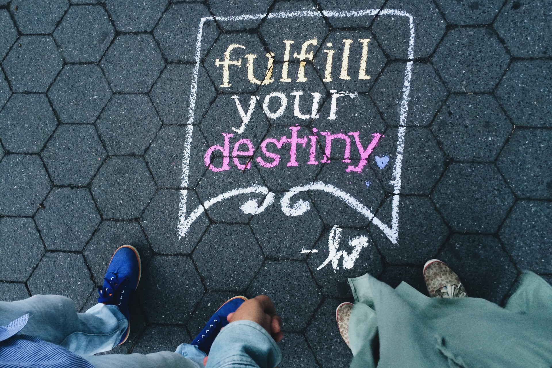 Sidewalk chalk art drawn by two children