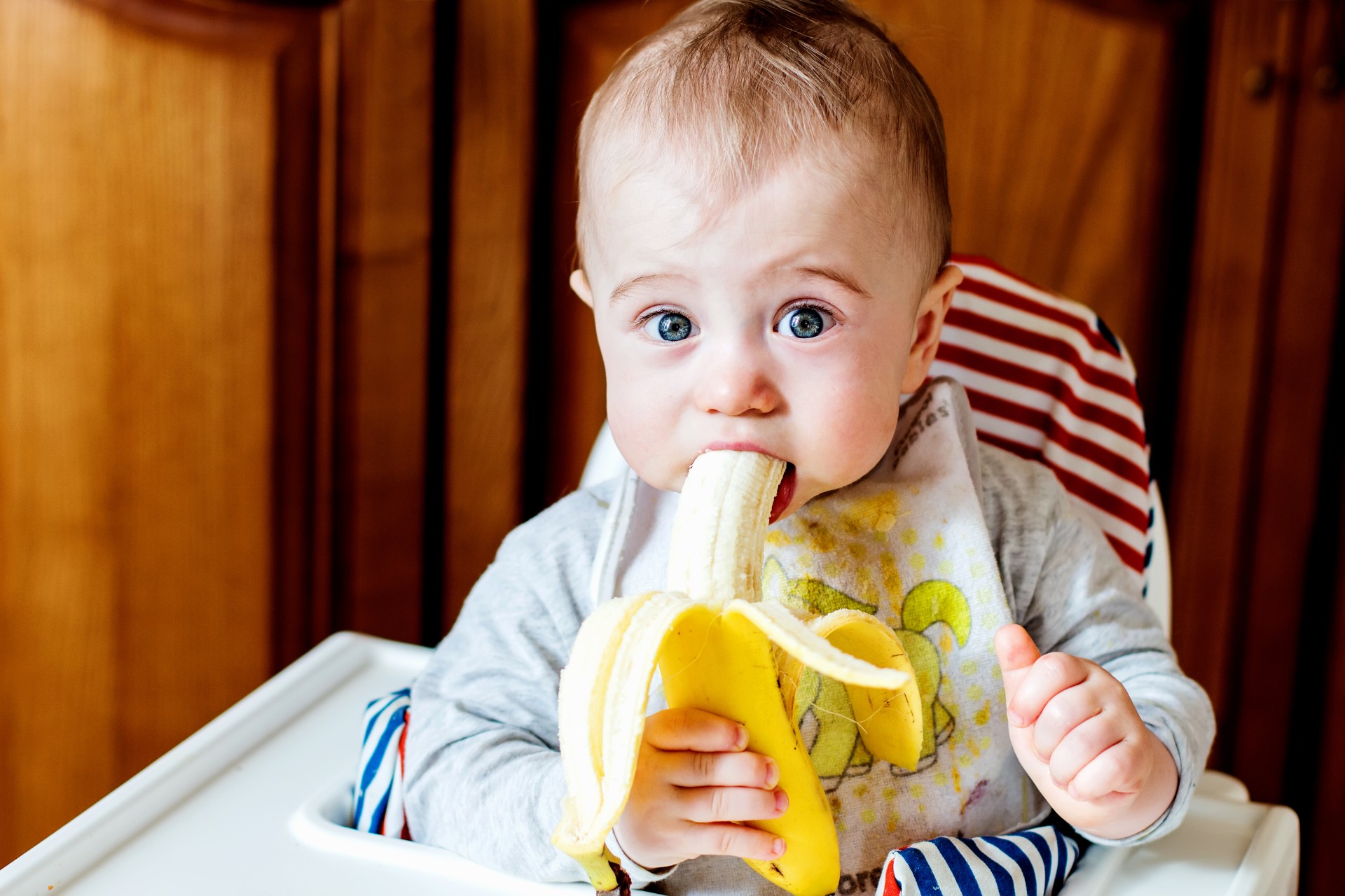 Baby eating a banana