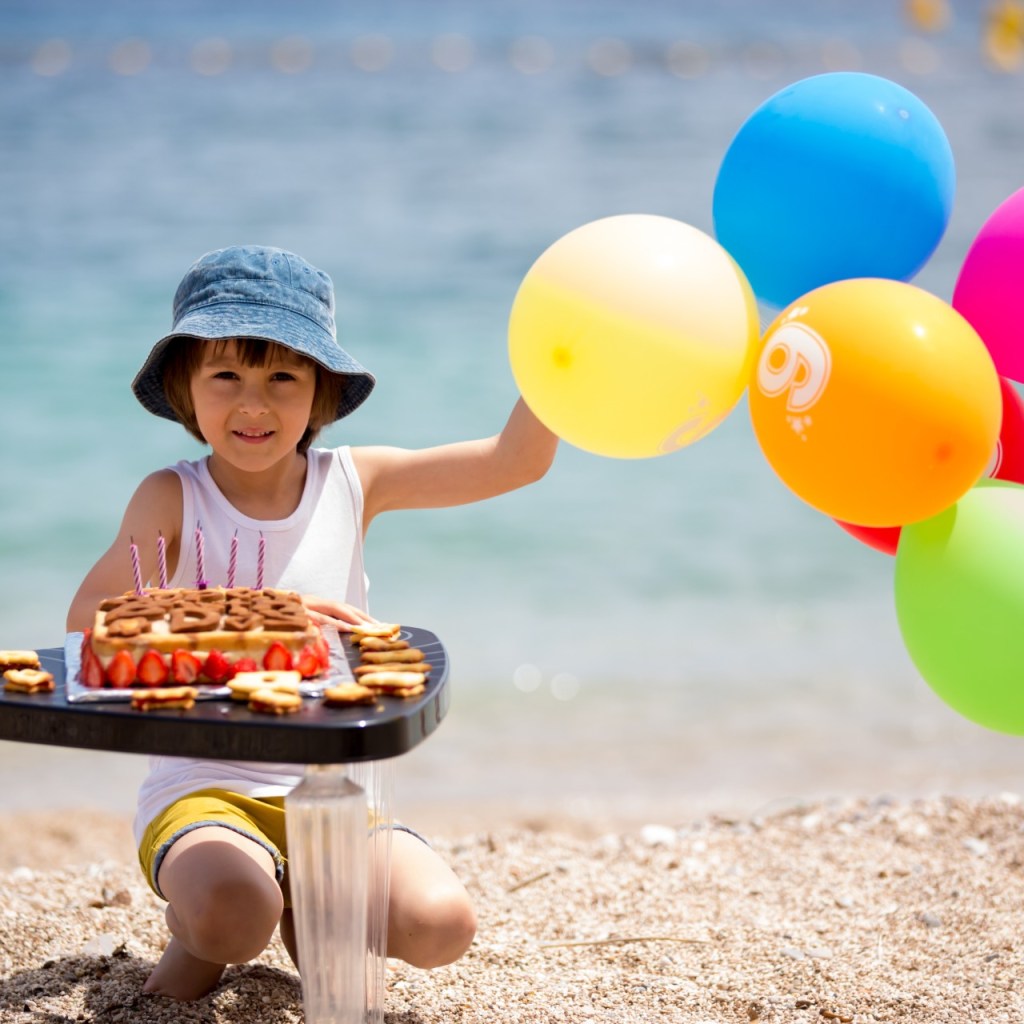 Smiling toddler in backyard pool