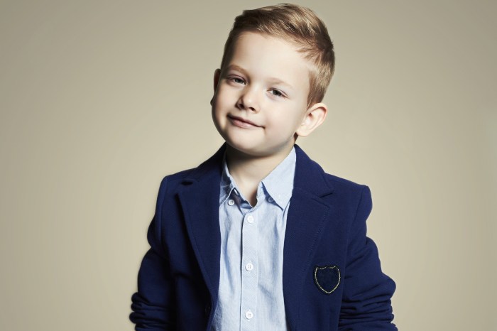 Young boy modeling fancy clothes