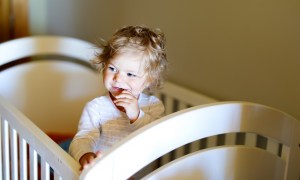 Toddler painting at a table