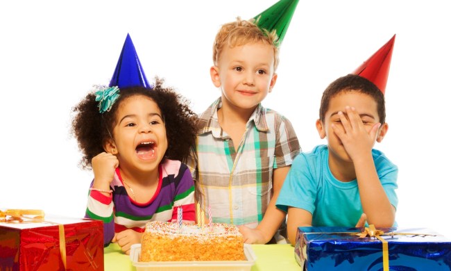 Three kids celebrating a birthday party