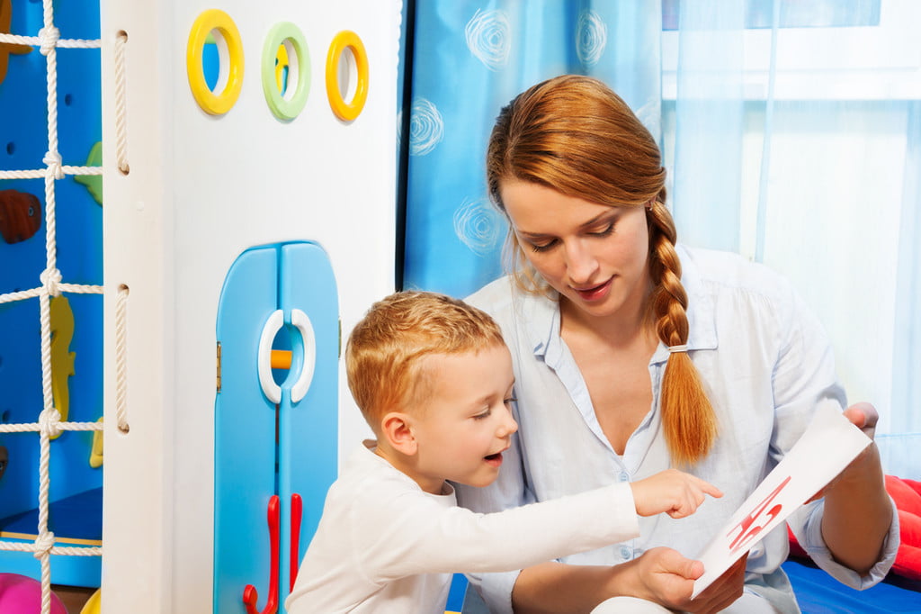child looking at flash cards