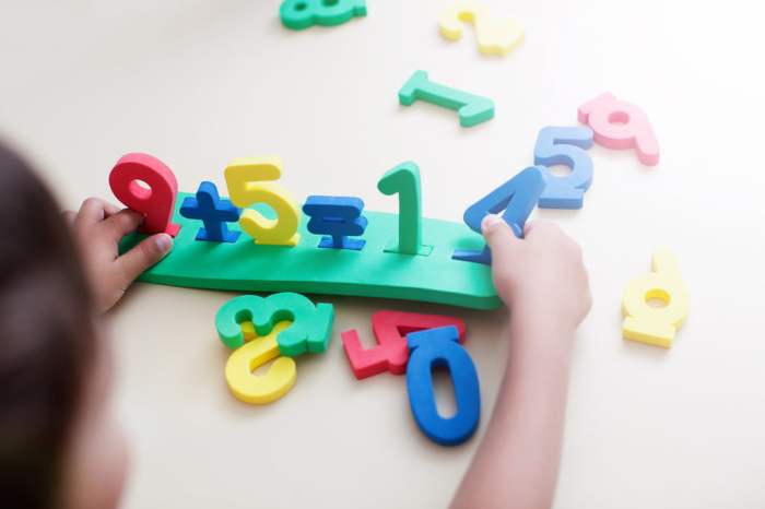 Child playing with colored numbers