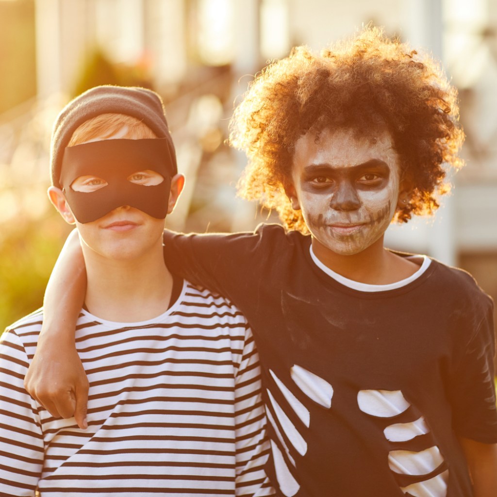 Two boys wear DIY Halloween costumes.