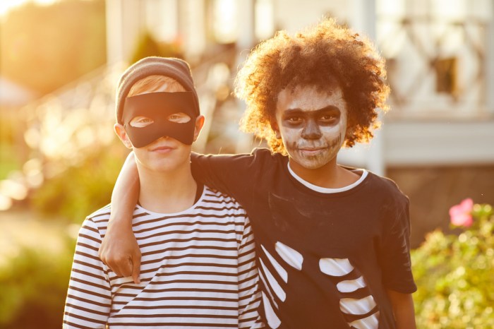 Two boys wear DIY Halloween costumes.