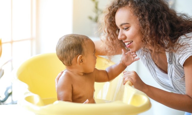 Mom giving her baby a bath