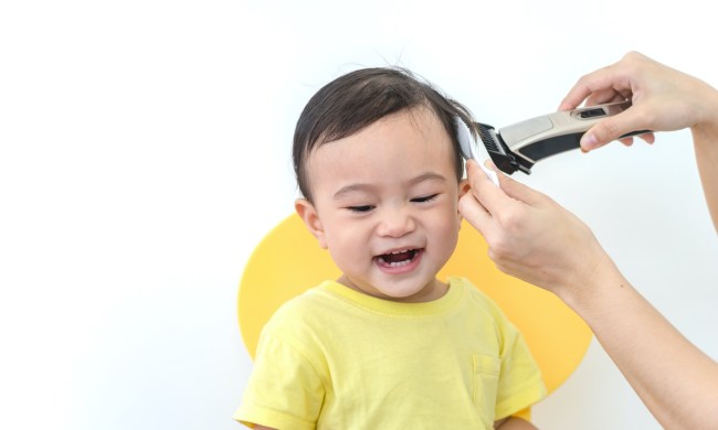 Baby getting a haircut.