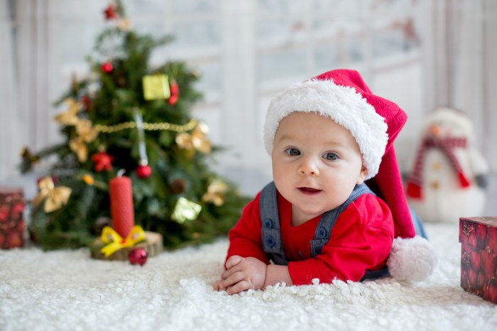 Baby in front of a Christmas tree