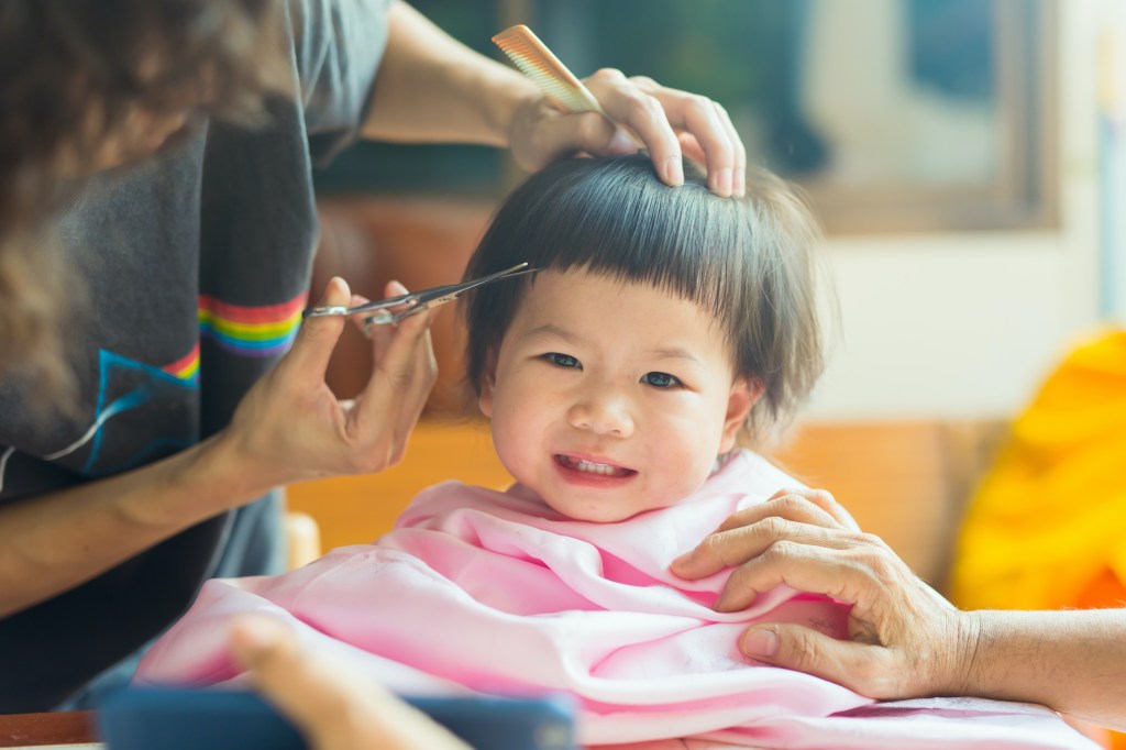 A child receiving a haircut.