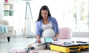 Pregnant woman packing a hospital bag