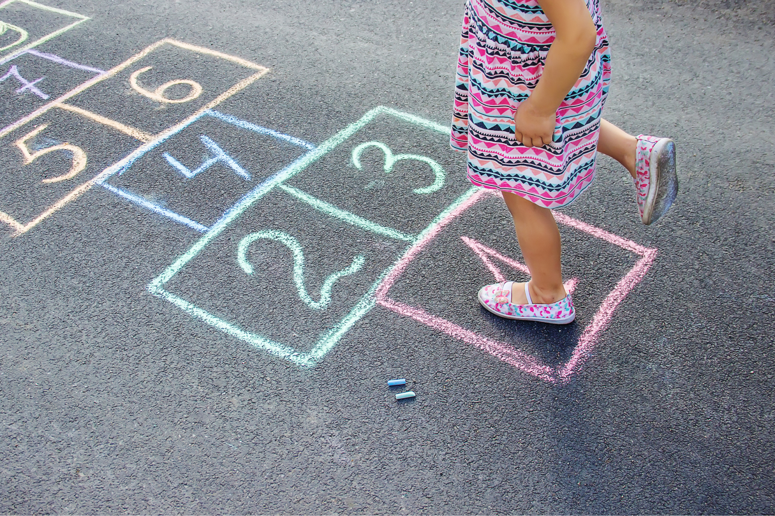 Girl playing hopscotch