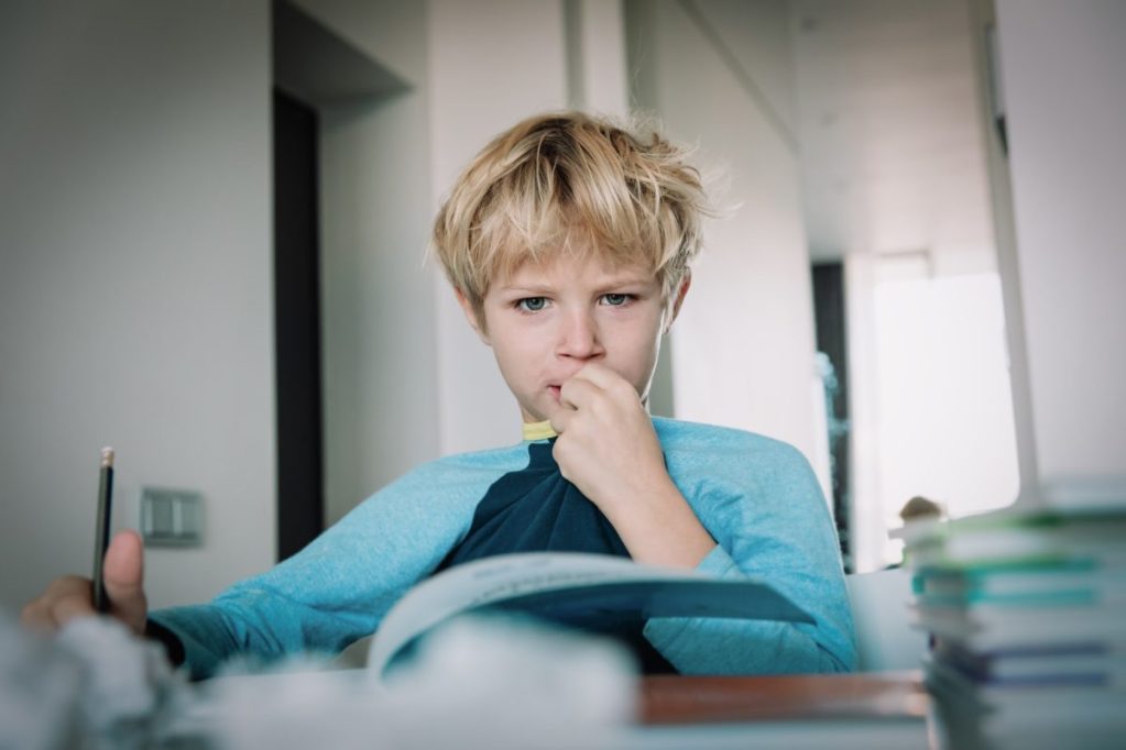 Child chewing on his shirt collar.