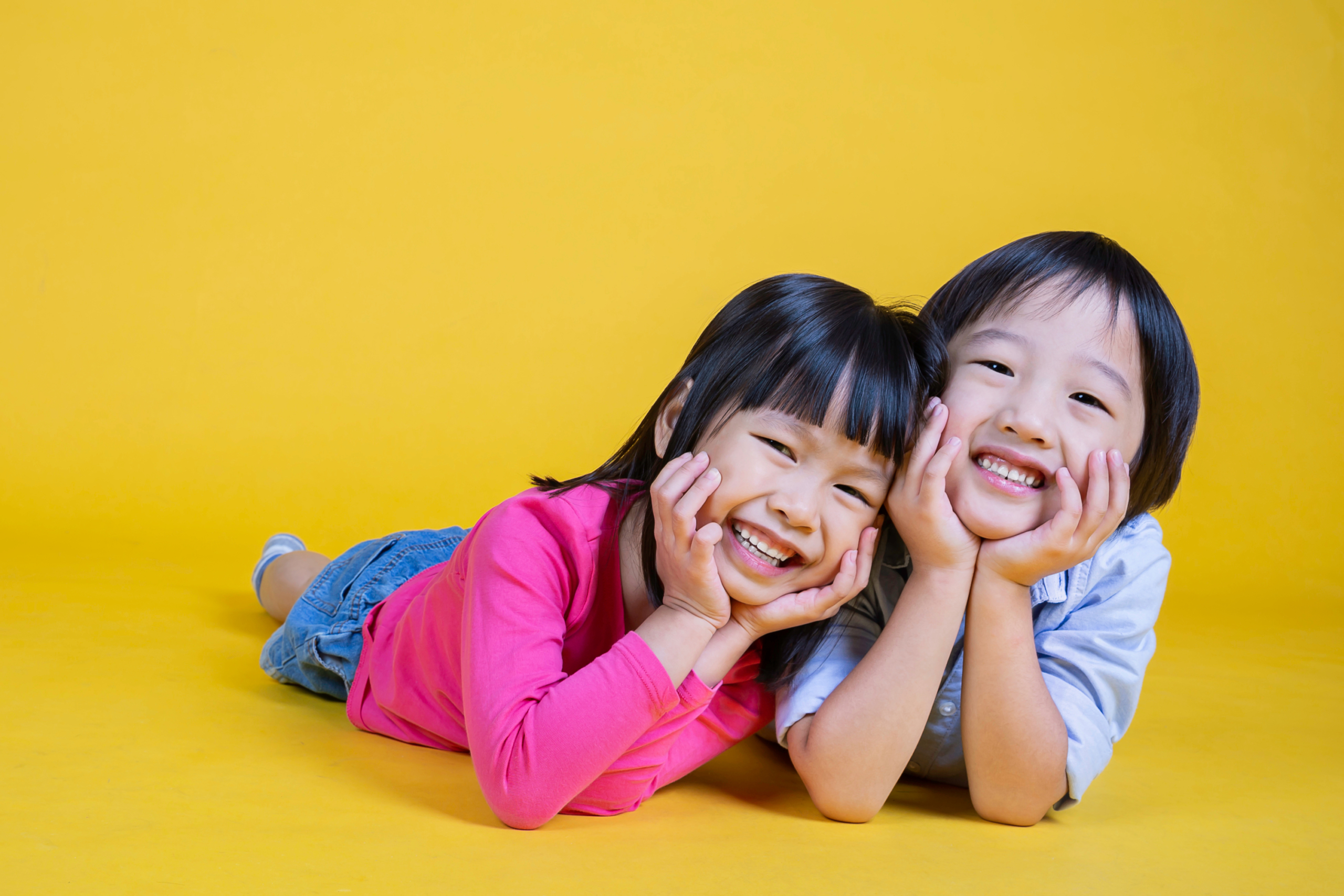 Two smiling girls in a photoshoot
