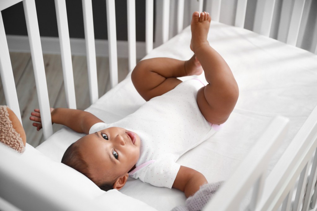 Baby boy in a crib.