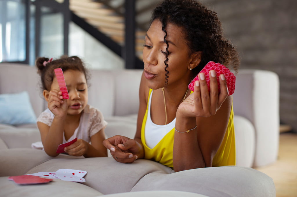 Mom and daughter playing card games