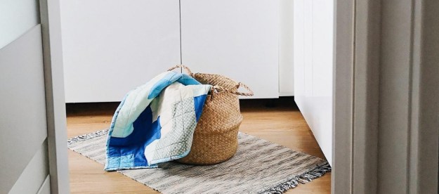 Laundry basket on top of a rug