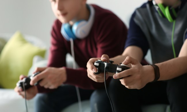 Teens having fun playing video games