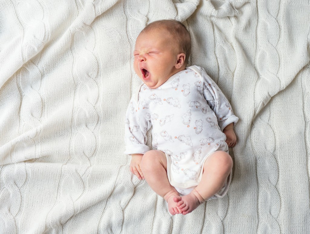 tired baby yawning