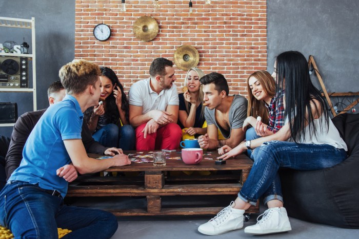 Teens playing a board game