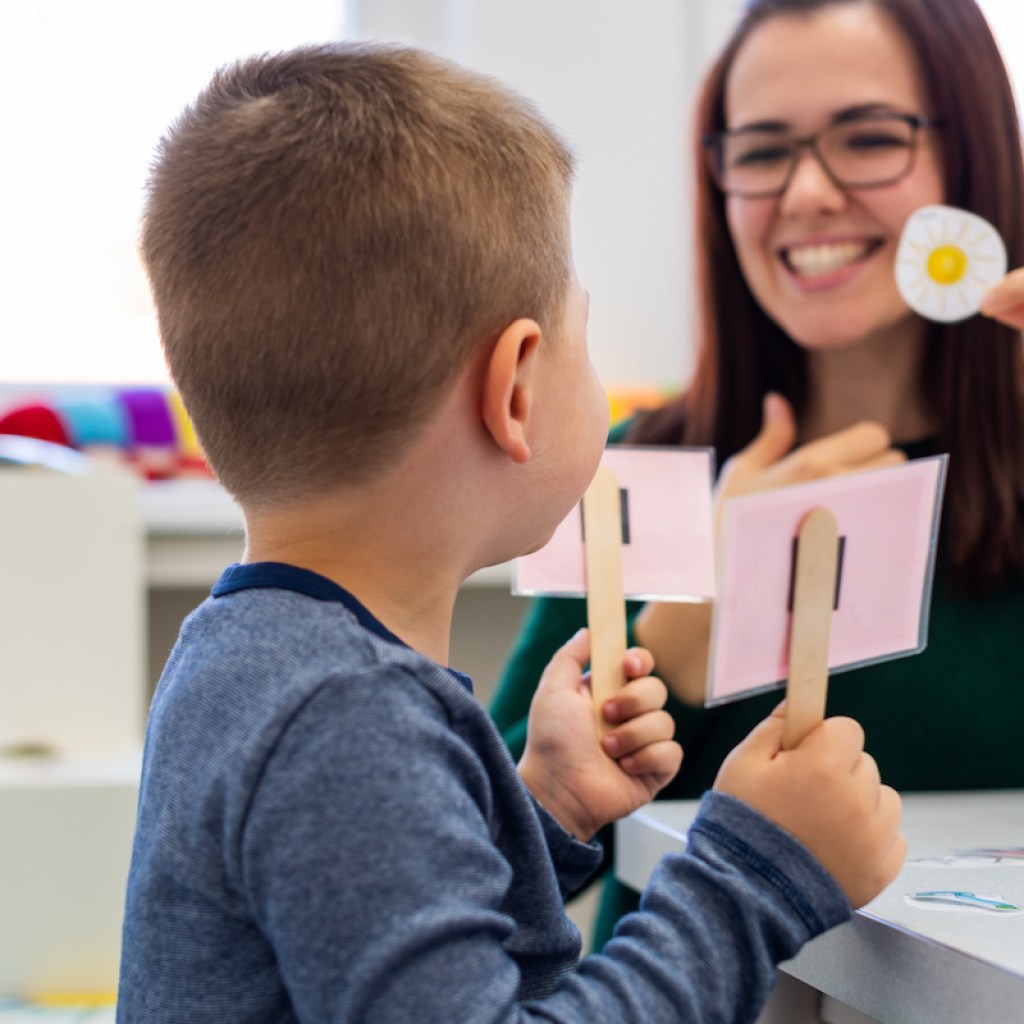 Child practicing speech therapy