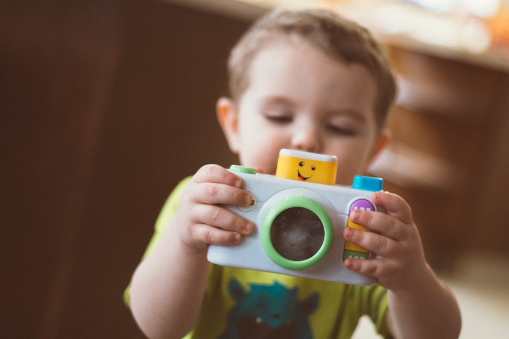 toddler taking a picture