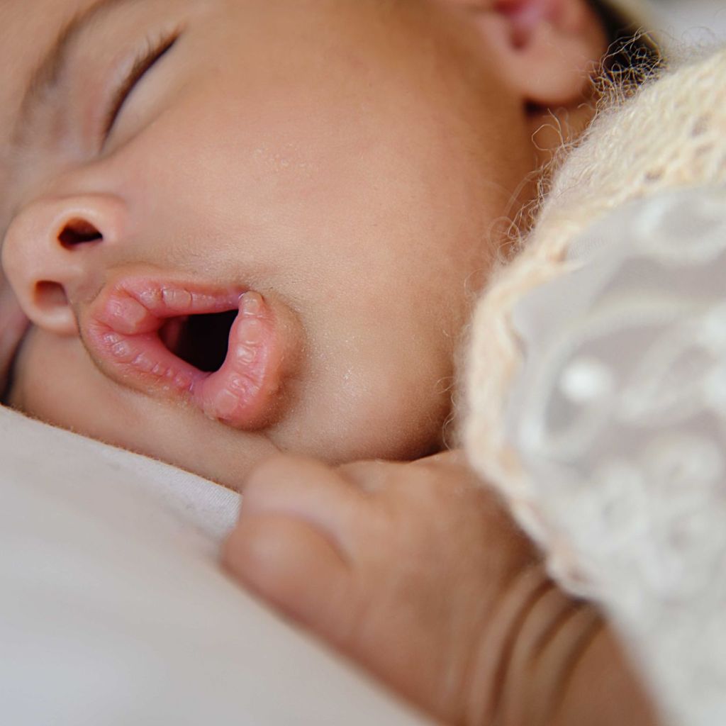 Baby sleeping with mouth open