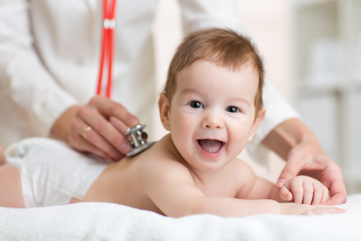 A happy baby gets a doc checkup