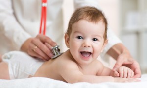 A happy baby gets a checkup