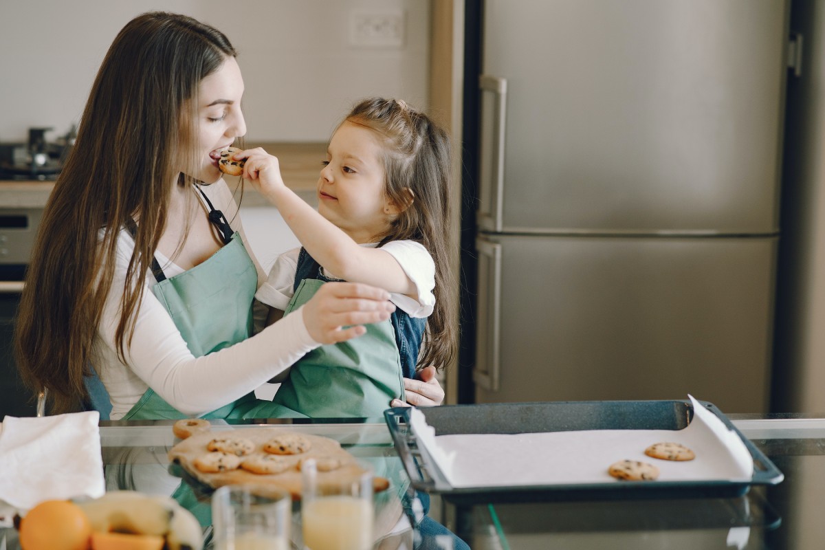 Mom and child baking together