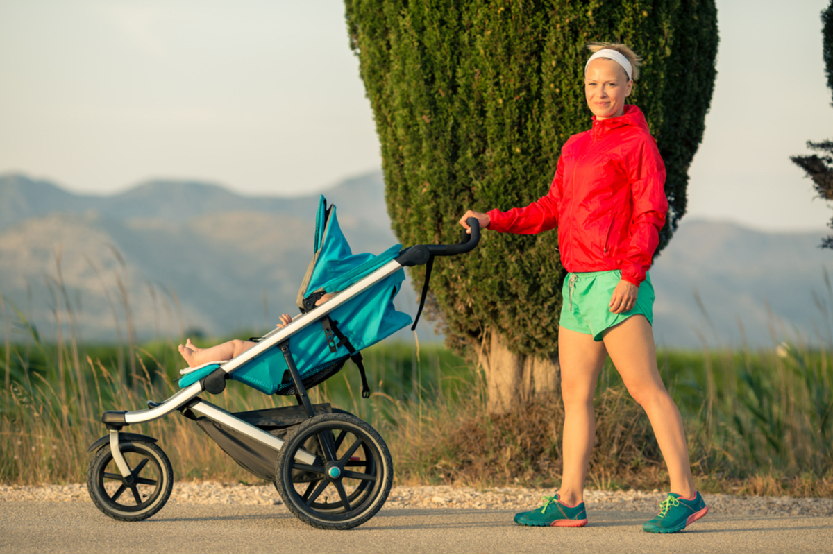 A woman, baby and running stroller