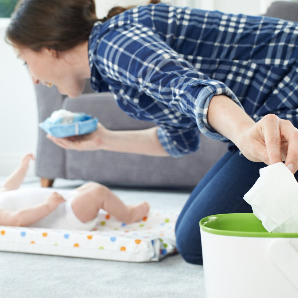 Mother throwing away baby wipe