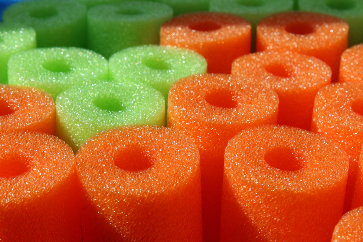Green and orange pool noodles