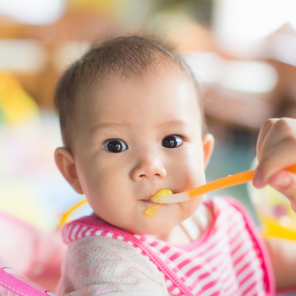 Baby eating food.